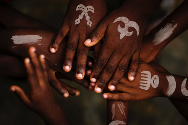 Uncle Chiefs Culture - Black Children with symbols holding hands